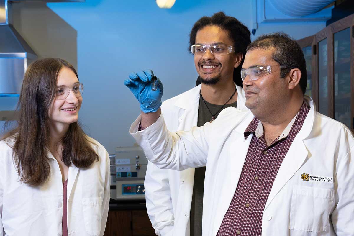 Dr. Chetan Dhital working on research with physics students.  / Dr. Chetan Dhital working on research with physics students. 