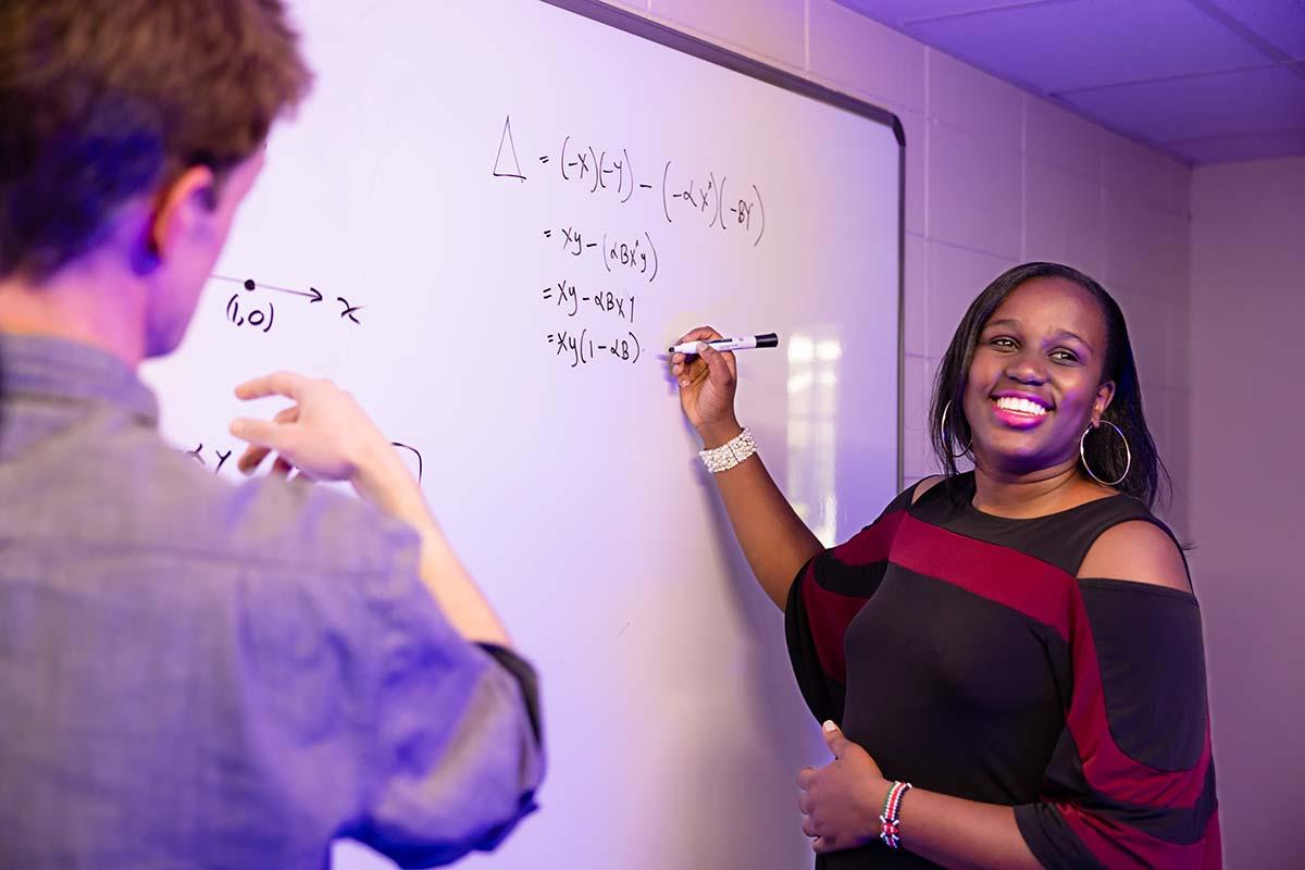 Faculty and student working on math research.  / Faculty and student working on math research. 