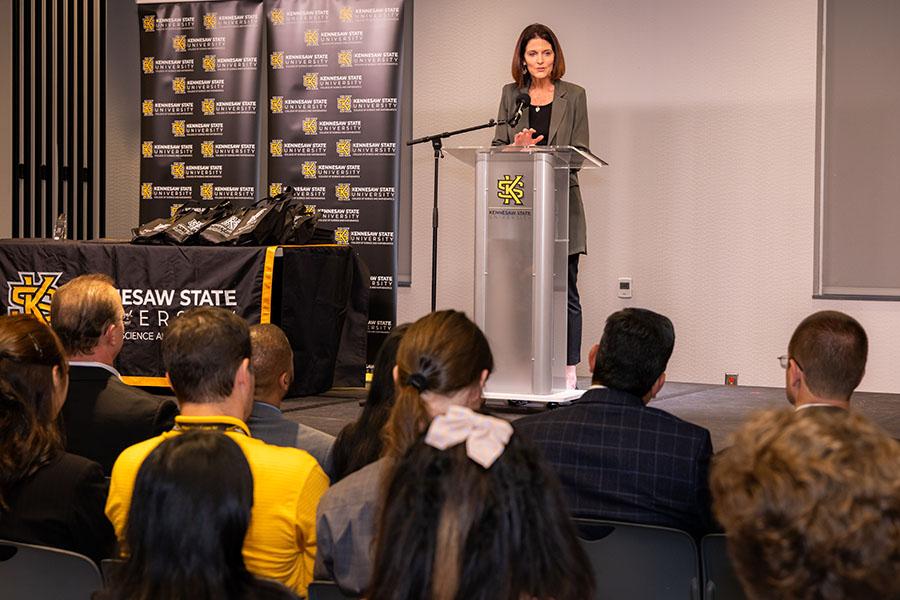 President Schwaig giving a speech in front of an audience at the Birla Carbon Research Symposium event. / President Schwaig giving a speech in front of an audience at the Birla Carbon Research Symposium event.