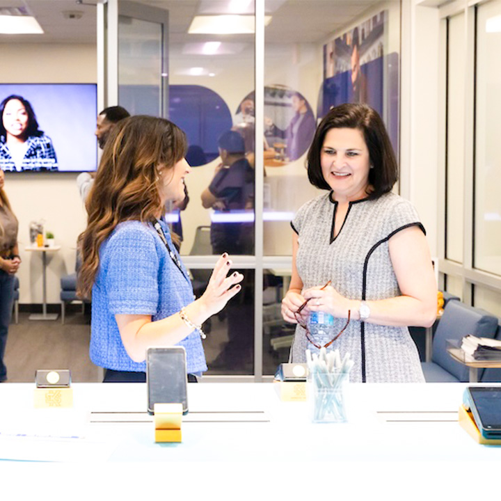 faculty in ksu's new ingenico lab looking at new payment equipment