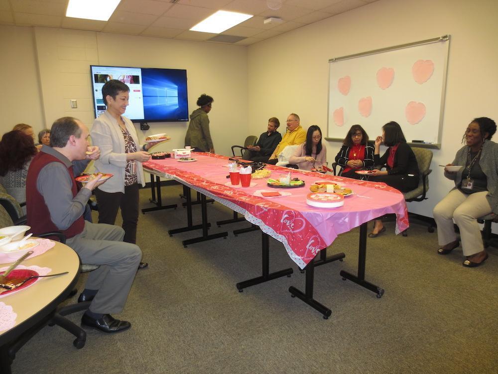 / people having cake in meeting room 