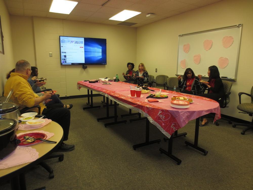  / people having cake in meeting room 