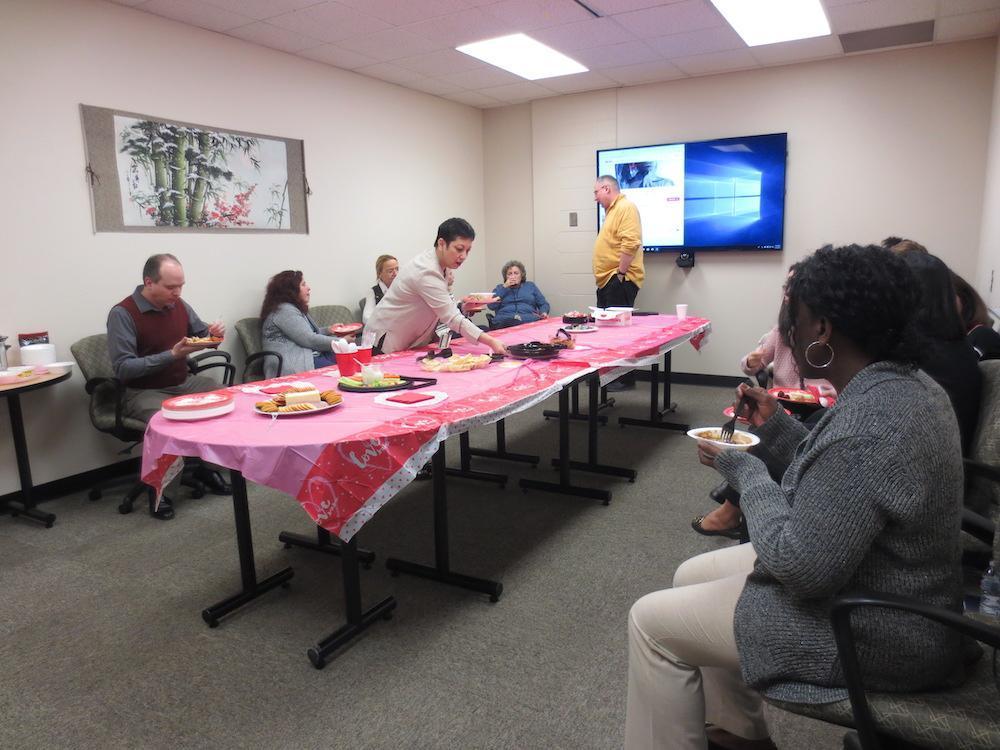  / people having cake in meeting room 
