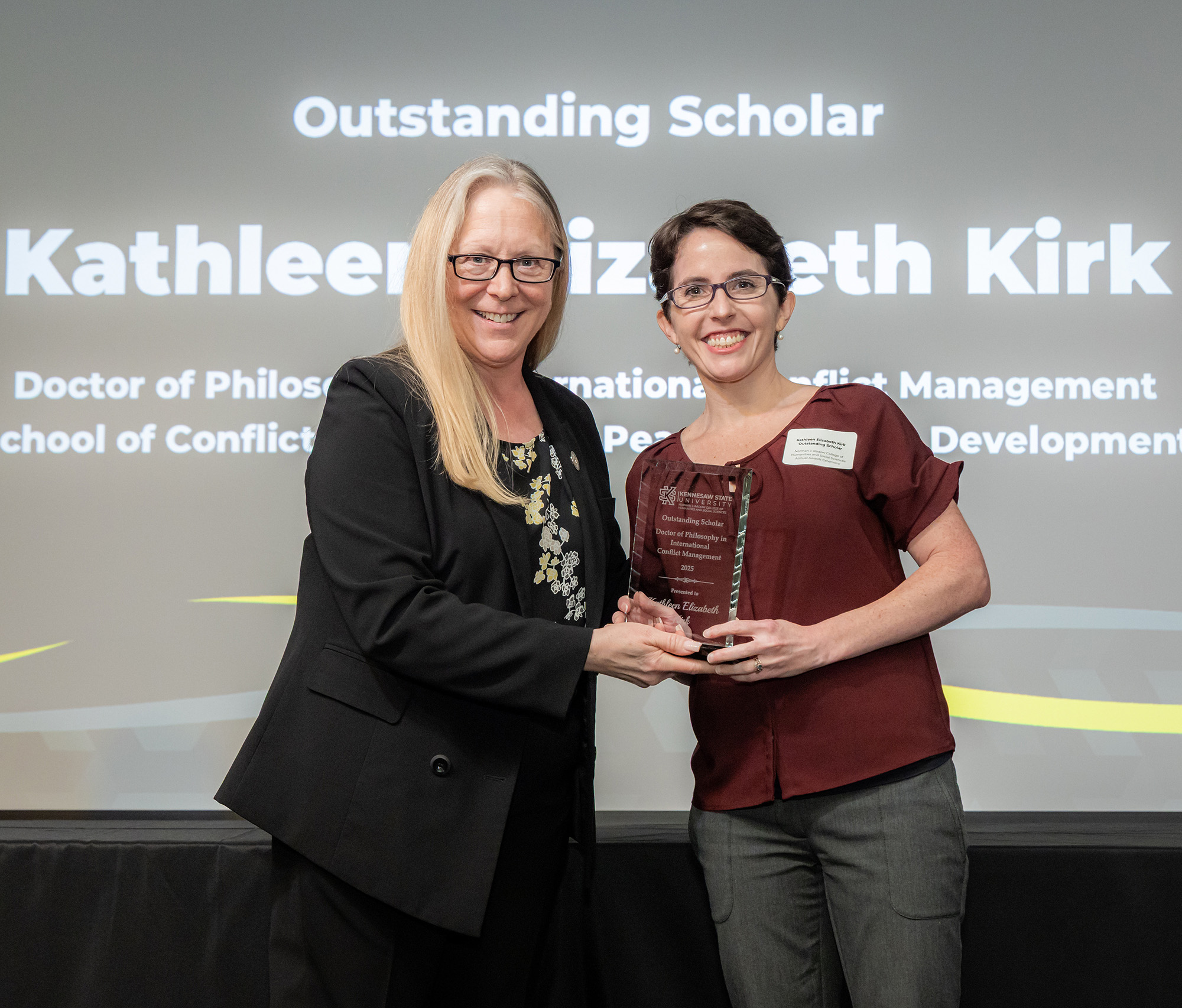 Dean Kaukinen presenting award to Kathleen Kirk