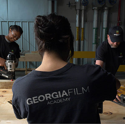 students working on set