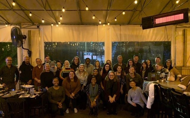 Group of KSU alumni and friends at a social gathering.