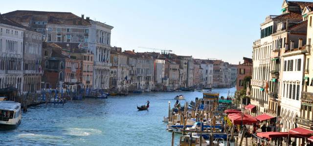Scenic view of the Grand Canal in Venice, Italy, with gondolas and historic buildings.