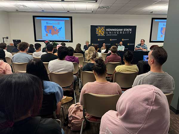 Panelists talking about electin results 2024 in front of class