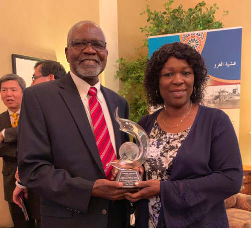 Dr. Akanmu Adebayo receives the Distinguished International Achievement Award for 2019.