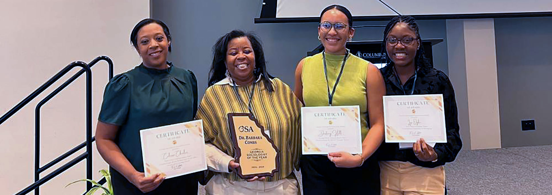 Dr. Combs with students, Destiny Hill (2nd place, mentor Bill White) , Calissa Charles (3rd place, mentor Jason Mueller) & Iye Ogbe (1st place graduate paper, mentor Darina Lepadatu).