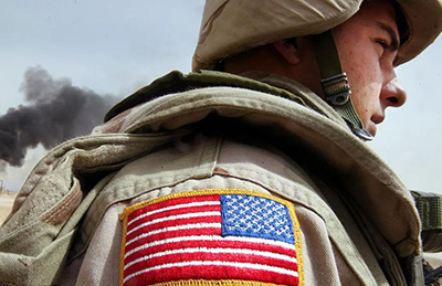 Photo of a soldier with american flag-patch
