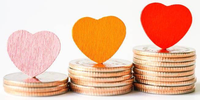 Coins with colorful hearts on top.
