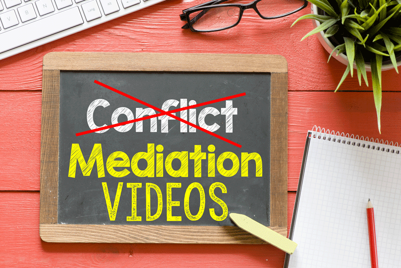 chalkboard with conflict (crossed out) mediation videos
