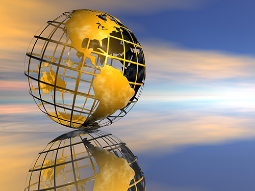A gold wireframe globe featuring north and south america with a ethereal sky behind it.