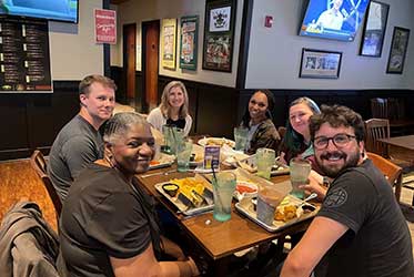 The class enjoying a meal together.