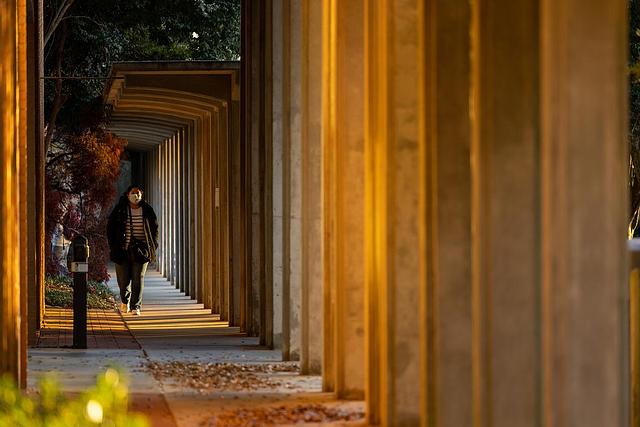 student in outside walkway