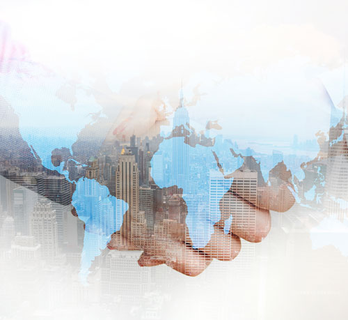 A businessman engages in a handshake against a city skyline, representing collaboration and professional growth.