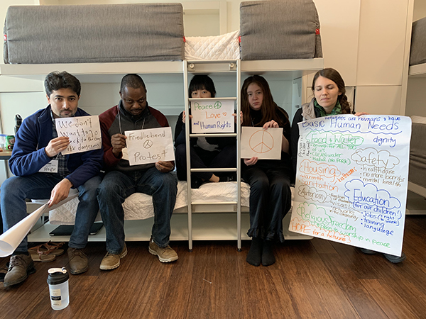 Students protest during humanitarian simulation