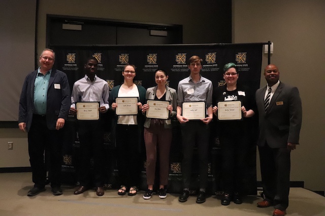 From left: Olaf Berwald (DFL Chair), Kwamé Akuffo, Carlie Bostek, Sam Baker, Andrew Hill, Kaelyn Ireland, and Shawn Long (Dean CHSS).
