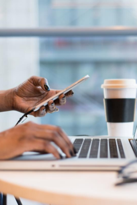 student working on laptop with coffee