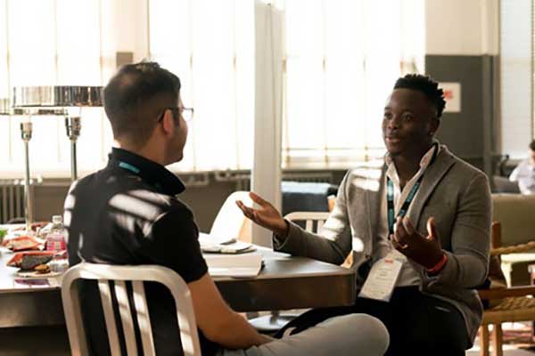 student talking with advisor about internship