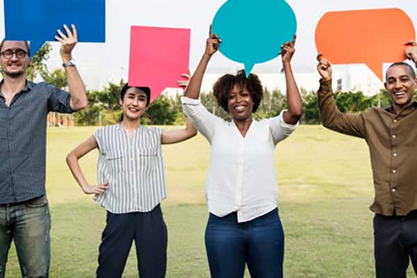 ksu students on campus holding blank speech bubbles