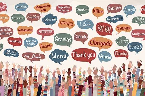 cartoon many different colored hands raised toward many different language text bubbles