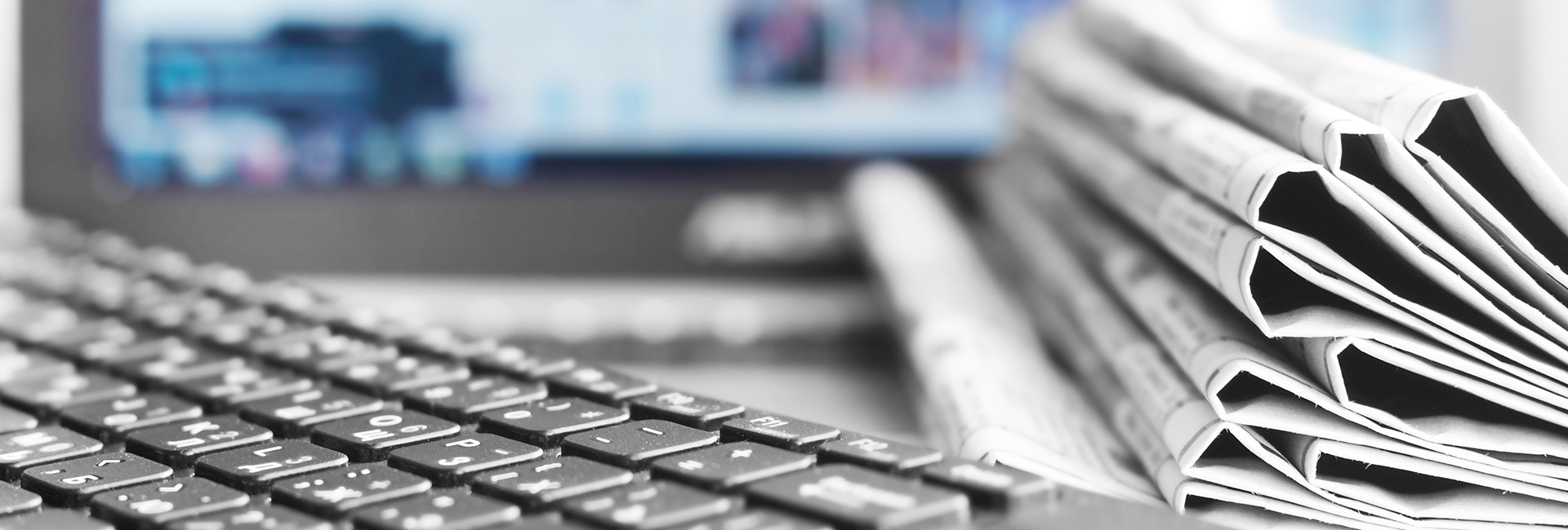 news paper with keyboard and computer monitor