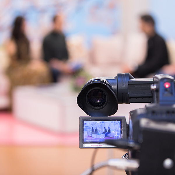 video camera with people in background