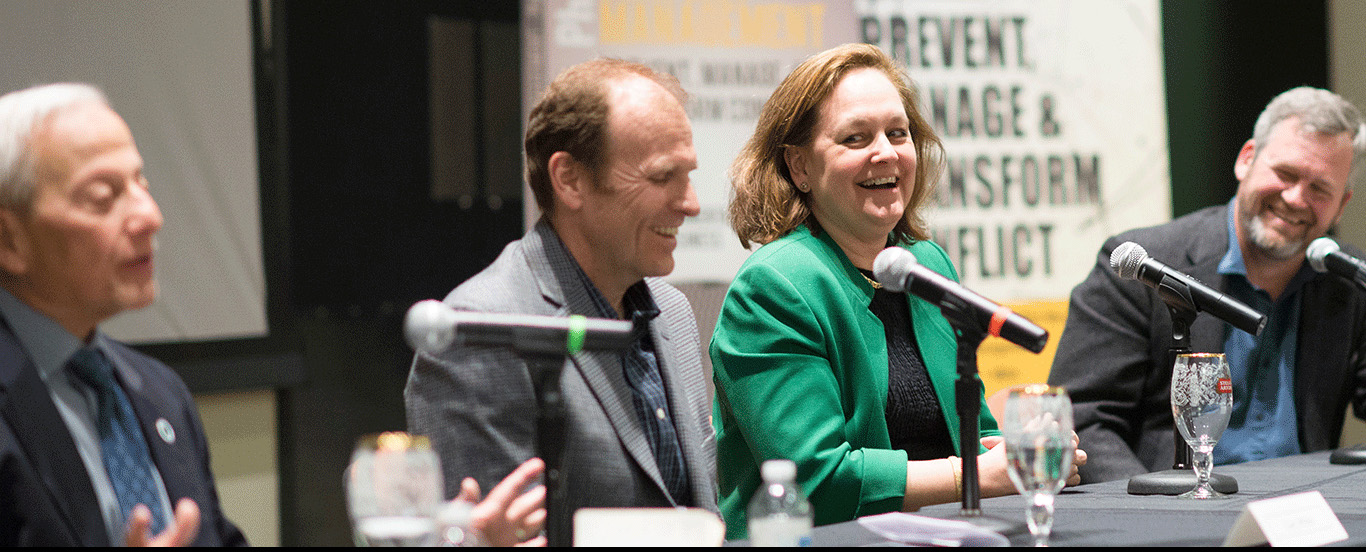 discussion panel with four adults