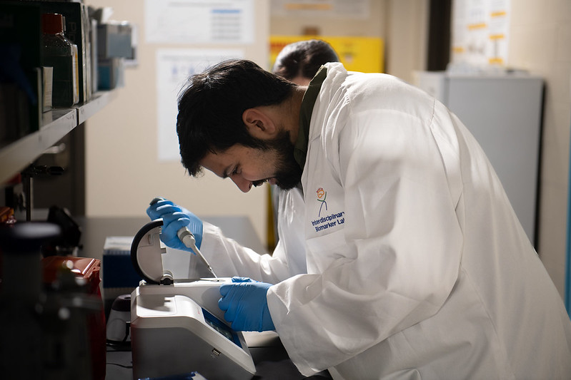 Student in Lab Coat with dropper