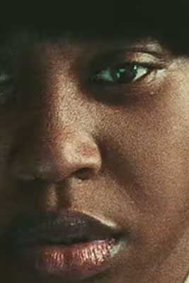 A woman's face on the cover of the publication "Swarm," by Jenae Harris