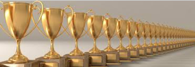 A row of gleaming gold trophies