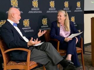 Dr. Katie Kaukinen, dean of RCHSS, and Dr. David Evans, dean and associate vice president of Library Services, prepare to welcome students to the Adobe Jam kick-off on the Kennesaw campus.