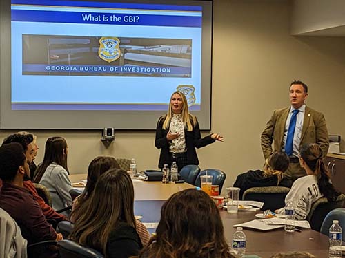 Special Agent Jamie Abercrombie and Special Agent Shilo Crane, give a presentation at KSU