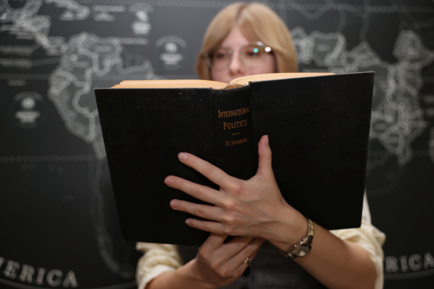 KSU Student Alexandria Currier reading a book