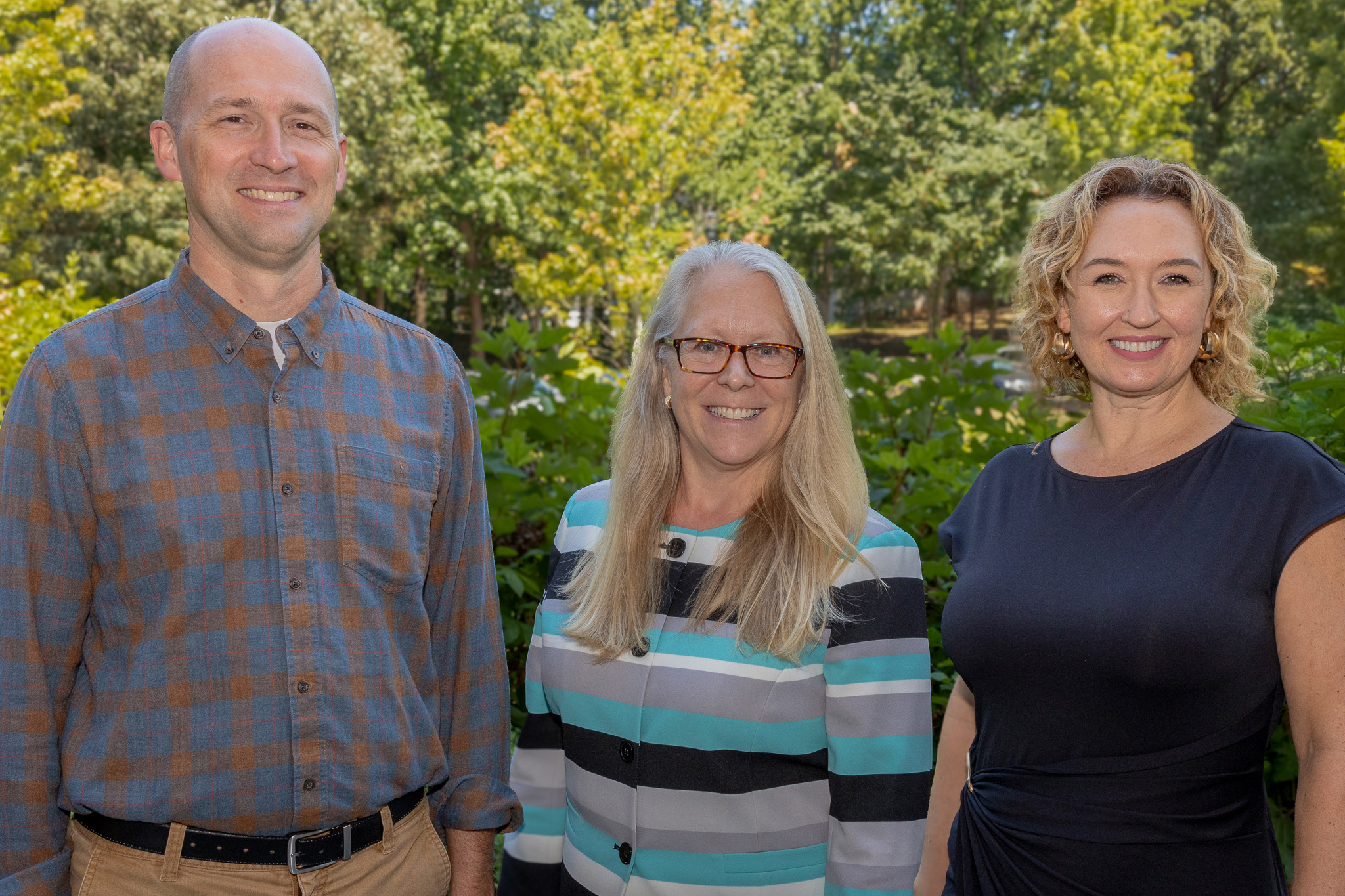 Tom Okie, Ph.D., professor of History Education and History and chair of the Department of History and Philosophy, Catherine Kaukinen, Dean of the Norman J. Radow College of Humanities and Social Sciences, and Michelle Devereaux, Ph.D., professor of English and English Education and director of English Education pose for a photo in Kennesaw, GA on August 20, 2026.