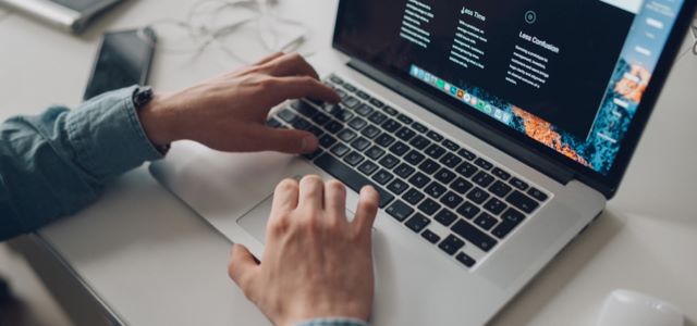 Person typing on a laptop