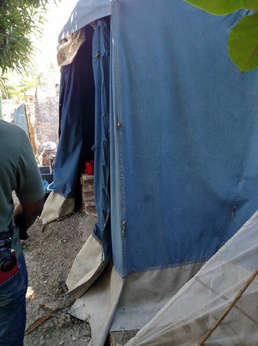  / A blue canvas tent with an open entrance