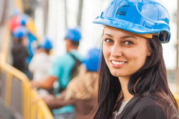girl in hard hat visiting site