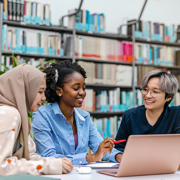 3 international students studying