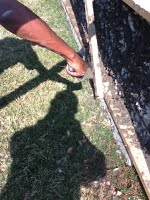 Concrete added to cover rubble and mesh on building structure