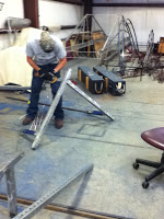 Concrete added to cover rubble and mesh on building structure