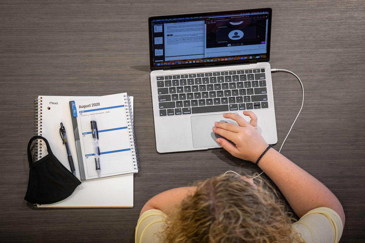 overhead view of person using a laptop