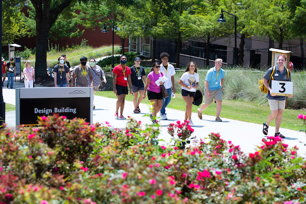people following guide person during orientation