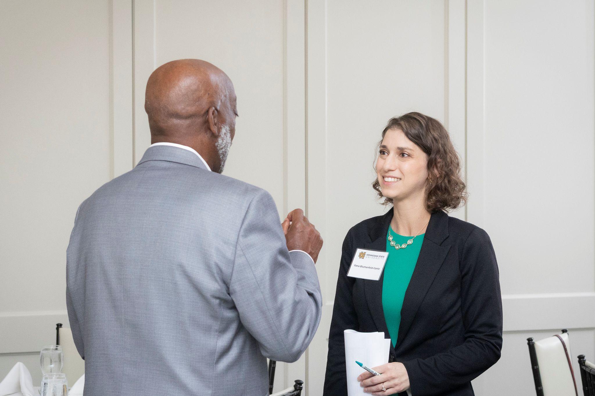 International Achievement Awards and Scholarship Ceremony 2026 / Ceremony attendees in a conversation.