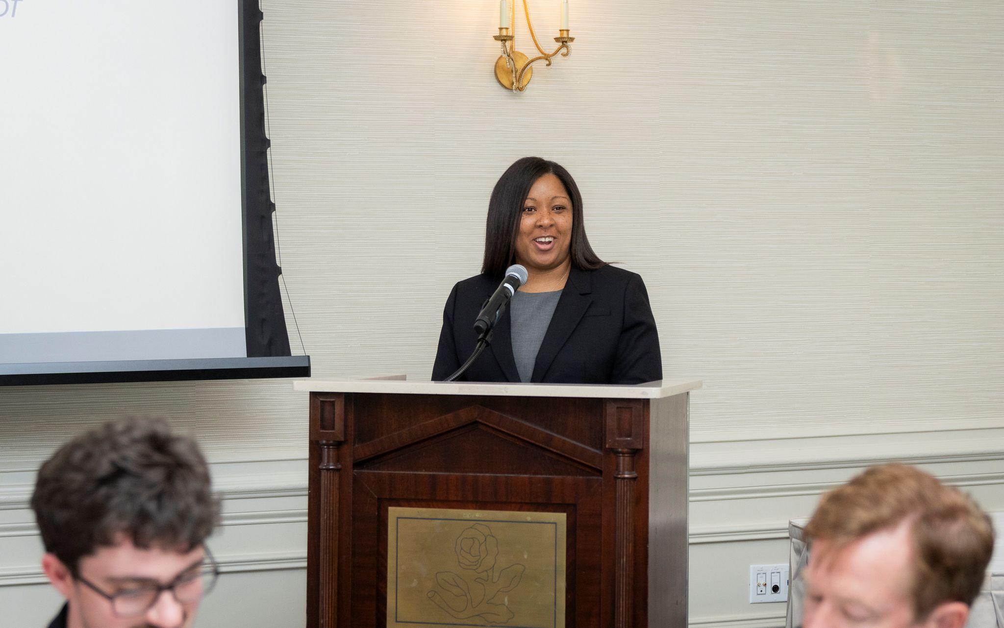 International Achievement Awards and Scholarship Ceremony 2026 / Tara McDuffie speaking behind a podium. 