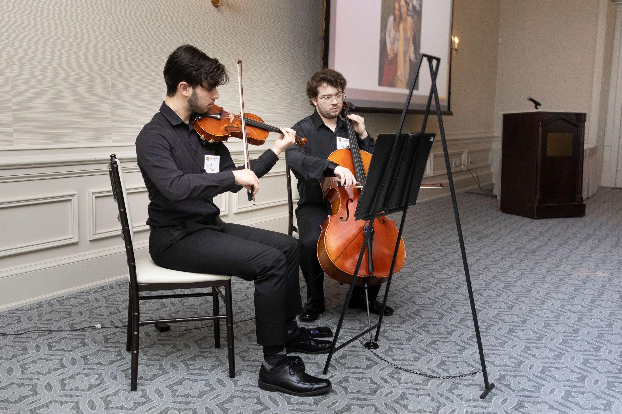 International Achievement Awards and Scholarship Ceremony 2026 / Two musicians playing instruments. 