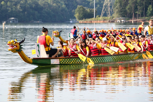 (Photo: Each boat held 20 rowers, a drummer at the front and steerer at the back. Team CIKSU worked to find their rhythm during the race.)