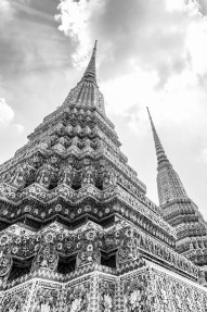 looking from the bottom up at a Thai temple in black and white